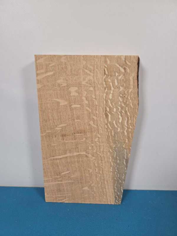 Figured oak offcut with distinctive grain pattern and textured surface.